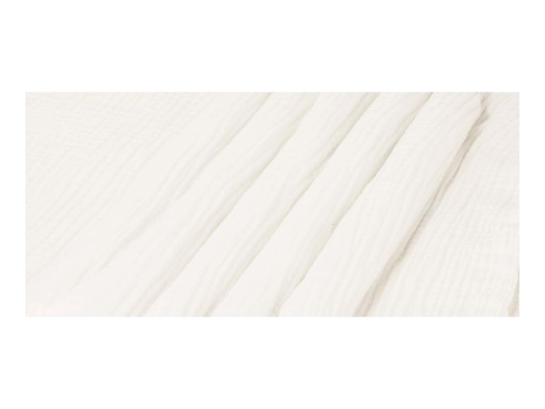 Texture de tissu blanc plissé, doux et léger.