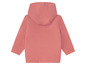 Une veste rose à capuche pour enfants.