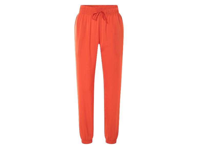Pantalon ample orange à cordon de serrage.