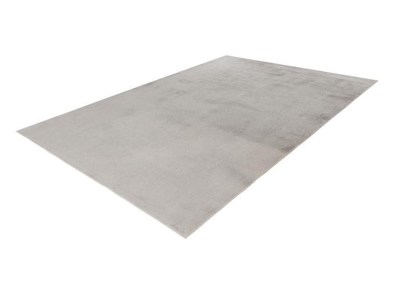 Tapis rectangulaire gris clair avec une surface douce et uniforme.