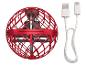 Un mini drone rouge avec une cage de protection et un câble USB.