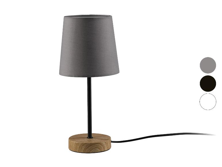 Une lampe de table grise avec un pied en bois