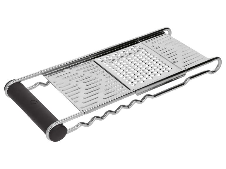 Râpe de cuisine en métal avec poignée noire, dotée de trois surfaces de râpage différentes.