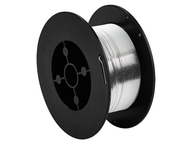 Bobine noire avec fil de soudure argenté, sur fond blanc.