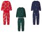 Trois ensembles de pyjamas de Noël pour enfants avec des imprimés festifs, en rouge, vert et bleu marine.