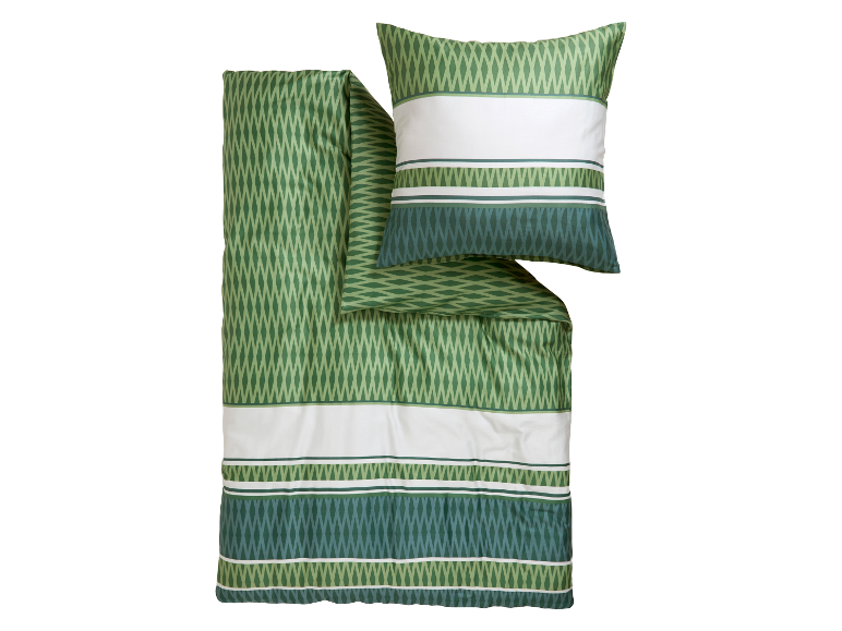 Parure de lit verte avec motif et taies d'oreiller assorties.