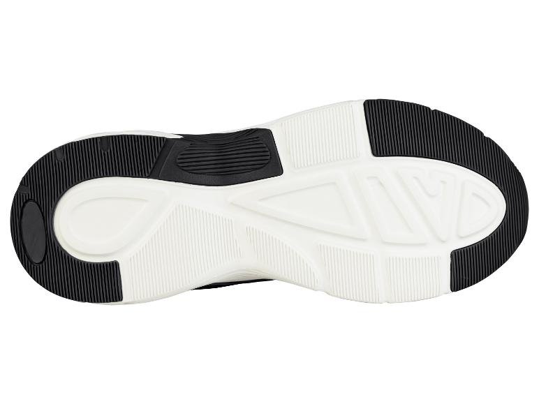 Semelle de chaussure de sport noire et blanche avec adhérence texturée