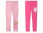 Deux leggings pour enfants, un rose clair avec Skye de Pat' Patrouille et un rose foncé avec un logo Barbie.