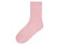 Une chaussette rose avec des points antidérapants.