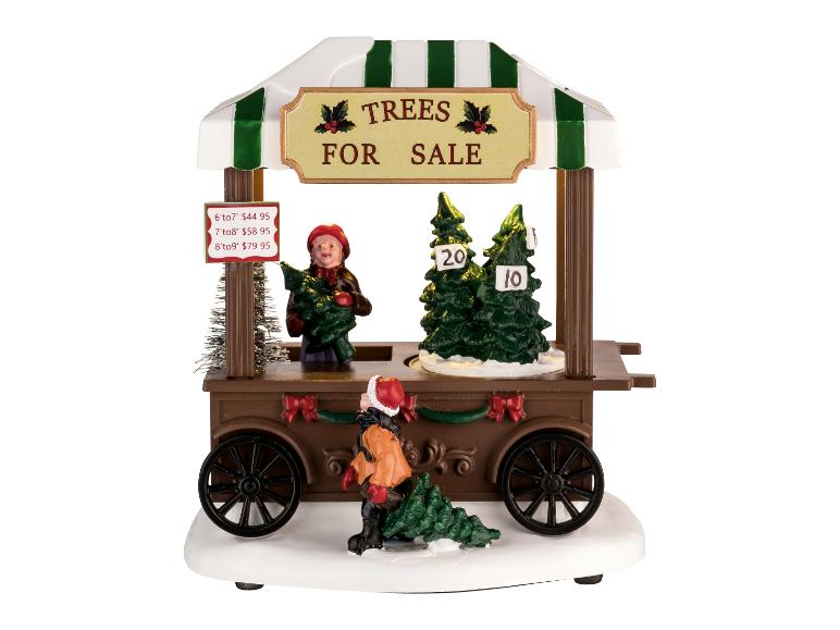 Figurine de Noël représentant un stand de vente de sapins et des personnages.