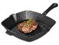 Steak grillé sur une plaque de cuisson en fonte.