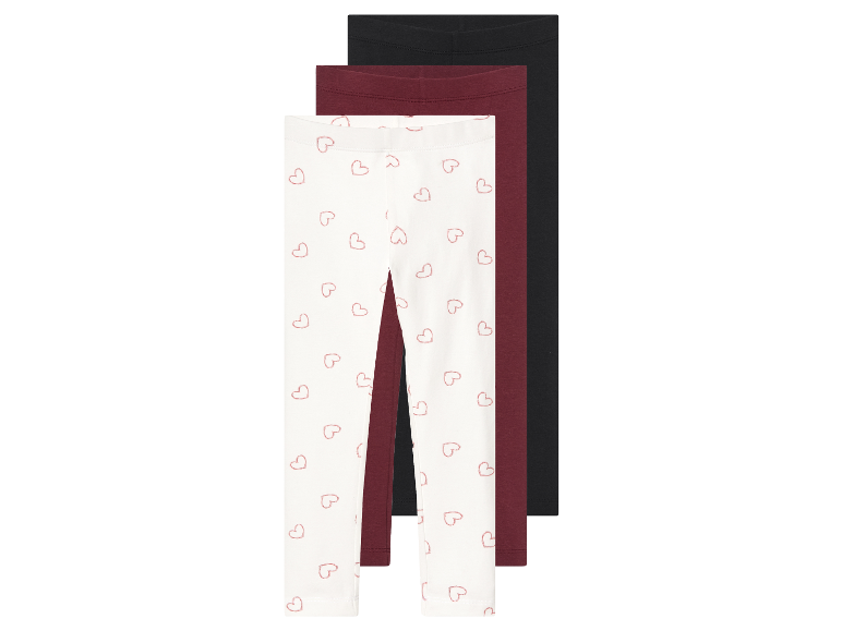 Trois leggings pour filles : un avec imprimé cœurs, un bordeaux et un noir.