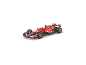 Une voiture de course de Formule 1 rouge avec divers logos de sponsors, vue d'un angle élevé.
