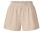 Shorts beige en tissu froissé avec taille élastiquée.