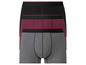 Trois boxershorts en noir, gris et bordeaux.