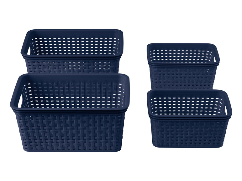 Quatre paniers de rangement bleu foncé avec un motif tressé.