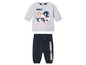 Un sweat-shirt gris avec Tweety Bird et un pantalon de jogging bleu avec le logo Looney Tunes.