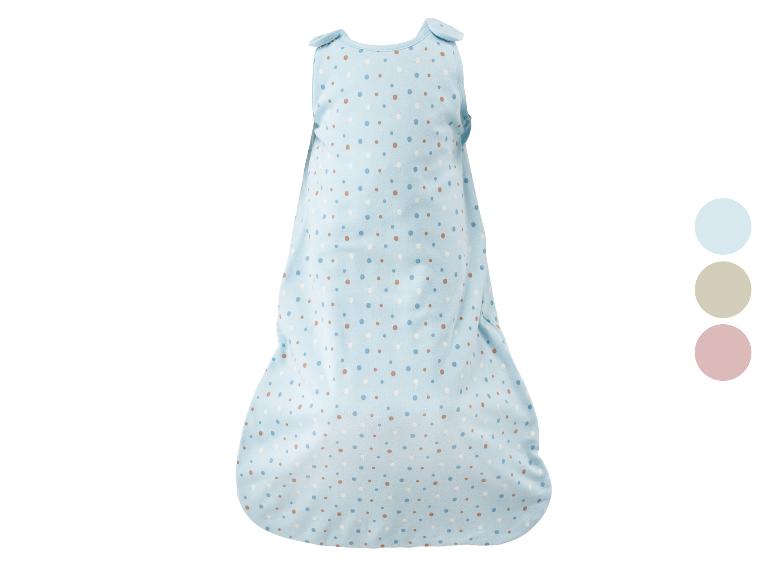 Gigoteuse bébé bleue avec motif à pois colorés.