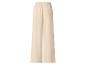 Pantalon large beige avec taille élastiquée.