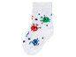 Des chaussettes blanches avec des motifs de monstres