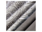 Tissu à imprimé paisley en gris et blanc.