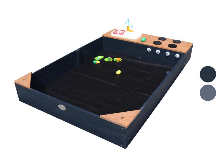 Bac à sable en bois bleu foncé avec cuisine de boue intégrée et accessoires de jeu.