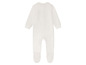Une combinaison blanche à manches longues pour bébé.