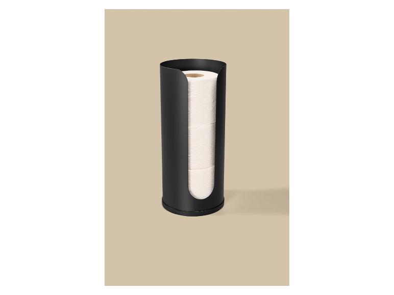 Porte-rouleau de papier toilette noir avec trois rouleaux de papier toilette sur fond beige.