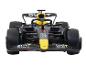 Une voiture de course de Formule 1 noire et jaune avec des sponsors BYBIT et Mobil 1.
