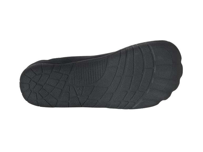 Semelle de chaussure noire, détail de la texture.