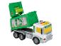 Un camion à ordures vert en jouet avec un conteneur basculant.