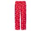 Pantalon de pyjama rouge avec imprimé de rennes blancs et cordon de serrage.
