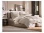 Drap-housse en mousseline LIVARNO home sur un lit dans une chambre.