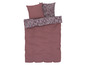 Une housse de couette rose avec un motif floral blanc.