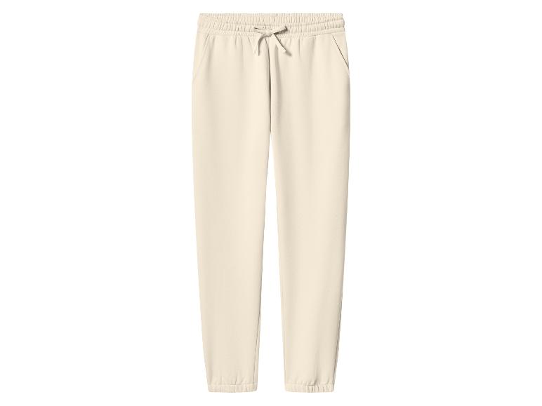 Pantalon de jogging beige clair avec cordon de serrage à la taille et poches.