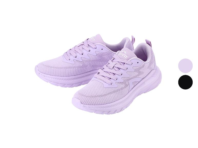 Une paire de chaussures de sport violet clair avec une semelle blanche et un cercle de choix de couleur noir et violet.