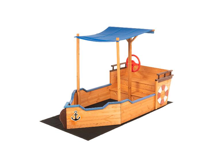 Bac à sable en bois en forme de bateau avec auvent bleu, volant rouge et bouée de sauvetage