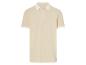 Polo beige à col contrastant et logo discret.