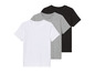 Trois T-shirts en blanc, gris et noir.