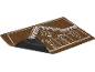 Paillasson thème maison en pain d'épices avec motif glaçage blanc sur fibre de coco marron.