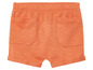 Short orange avec deux poches.