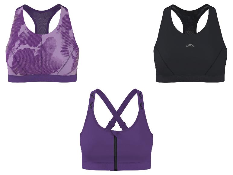 Trois soutiens-gorge de sport : un violet à motifs, un noir et un violet avec une fermeture éclair avant.