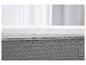 Matelas avec surmatelas blanc matelassé sur une base grise.