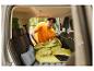 Sac de couchage et matelas gonflable installés dans une voiture pour le camping.