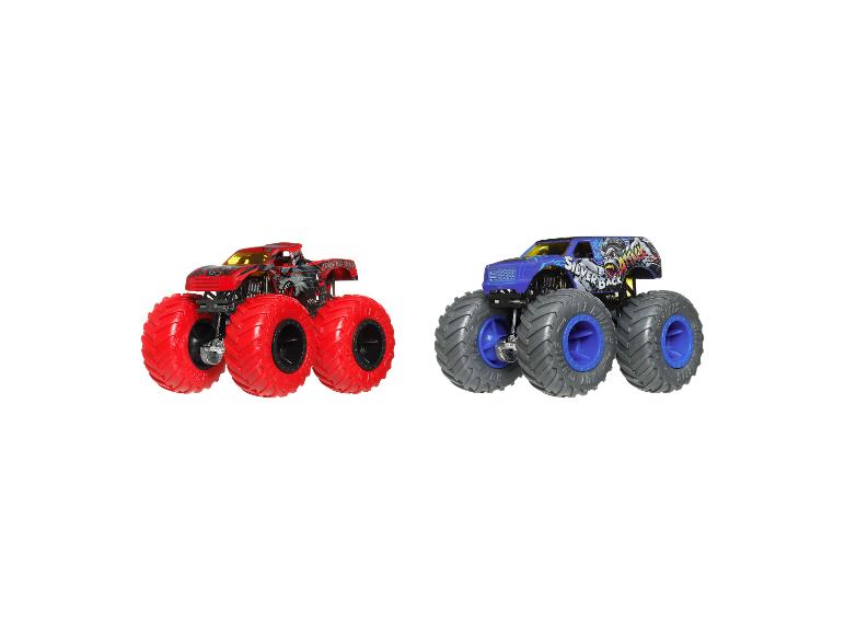 Deux camions jouets Hot Wheels Monster Trucks en rouge et bleu.