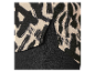 Haut et pantalon : imprimé abstrait noir et beige.