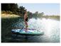 Femme faisant du paddleboard sur un lac, avec le texte '10'4' ALLROUND' sur la planche.