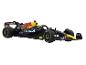 Une voiture de course de Formule 1 Red Bull noire et jaune avec le parrainage d'Oracle.