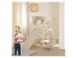 Structure de jeu en bois Rola avec toboggan et mur d'escalade.