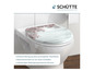 Un abattant de WC avec un design en bois et des fleurs roses.